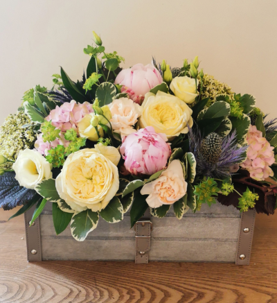 Just picked crate - Seasonal flowers with a country garden flavour arranged in oasis in a wooden crate. Please note - crate & flower choice may vary depending on availability. Large size pictured