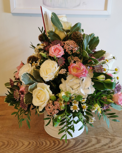 Pot of Happiness - A small but choice selection of flowers arranged in a petite container.